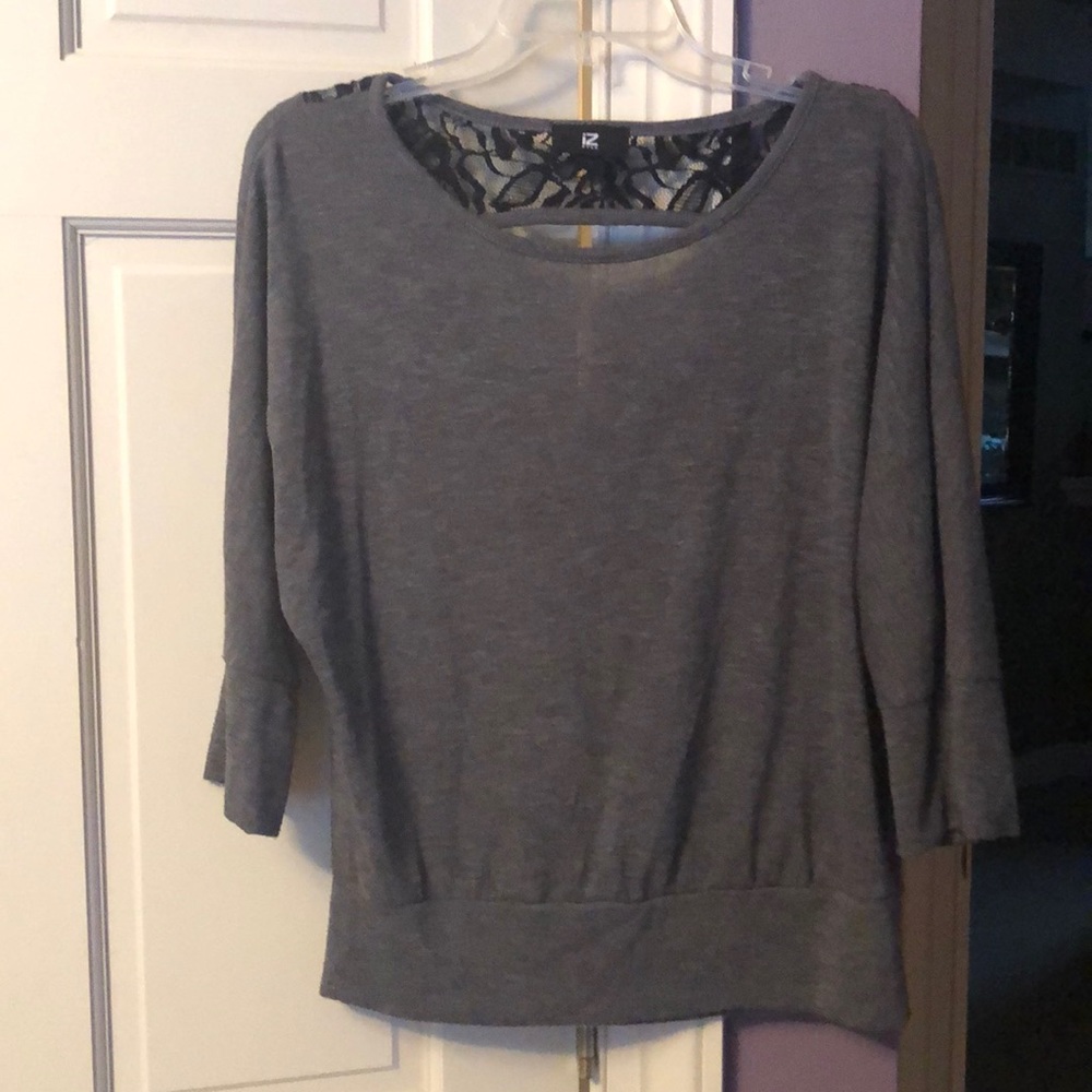 Gray sweater with open back at the top
